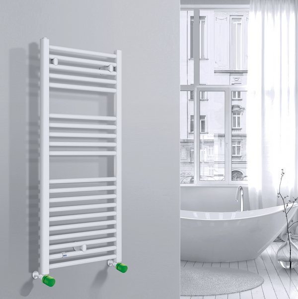 Valvola Custò colore verde giallastro fissata a un termoarredo ad acqua