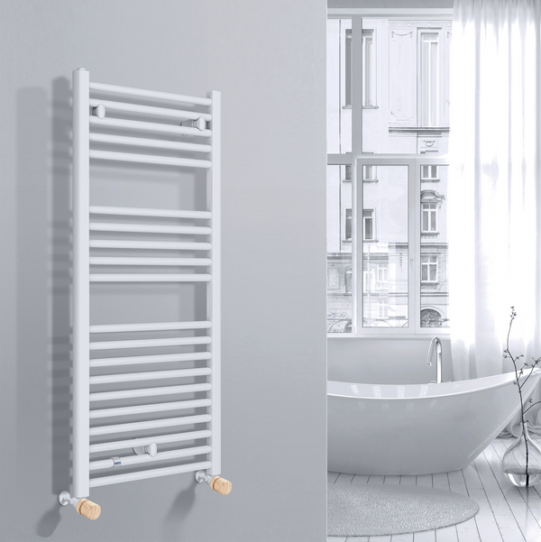 Valvola Custò colore abete fissata a un termoarredo bianco